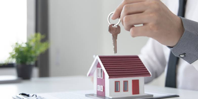 Home Buying Guide 2026 showing modern residential properties, apartments, houses, and key tips for choosing the right home.